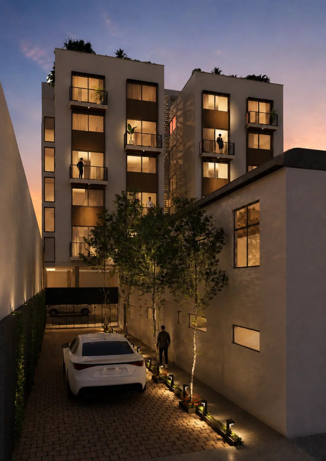 Acceso principal de Torre DUO Living al atardecer